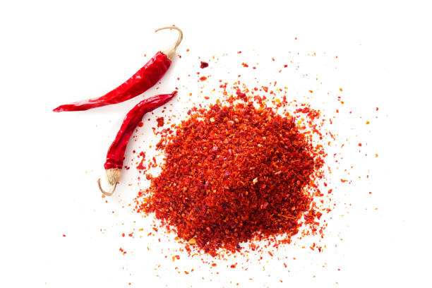 istock Red chili pepper powder on white background 689749830