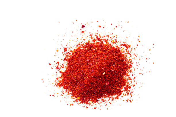 istock Red chili pepper powder on white background 689750022