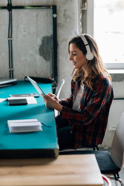 istock Woman podcasting in modern office 689750202
