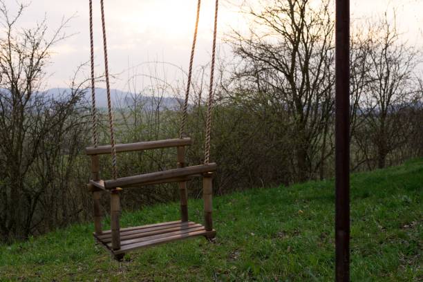 istock Colorful sunset framed in the kid's swing. 689755970