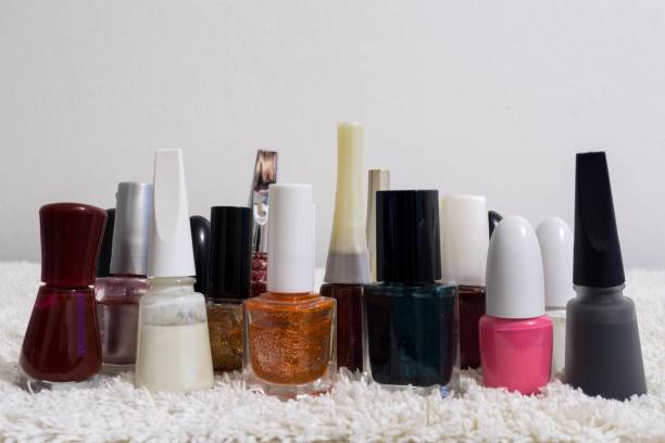 istock Nail polishes of many colors on a table 689759090