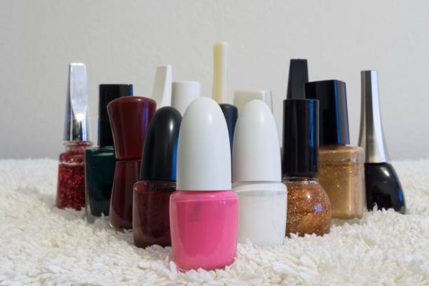 istock Nail polishes of many colors on a table 689759100
