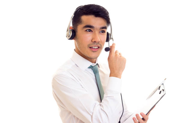 istock Young man in headphones holding a folder 689771520