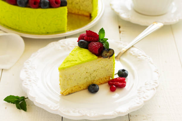 istock Home pistachio cheesecake with raspberries and blueberries. 689771662