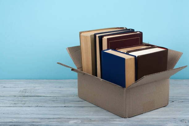istock Open books on on wooden deck table and blue background. Back to School. Education concept with copy space for your ad text 689789608