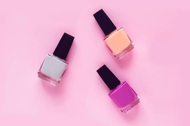 istock Colorful nail polishes on pink 689793890