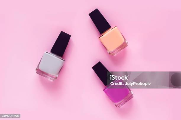 Colorful Nail Polishes On Pink Stock Photo - Download Image Now - Nail Polish, Above, Adult