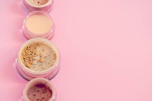 istock Mineral beauty makeup kit on pink 689793900