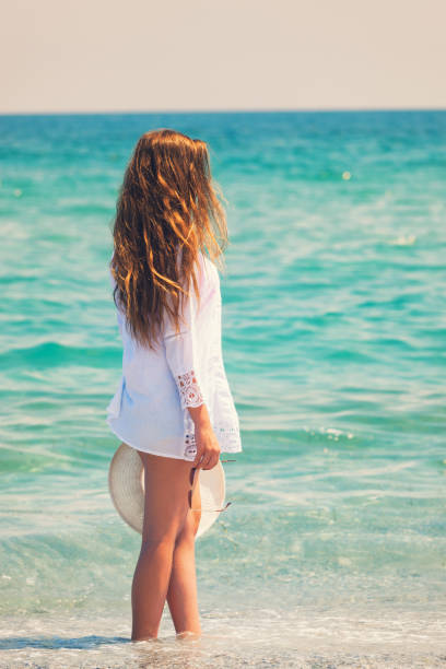istock Beautiful Young Girl Enjoying on The Beach 689794036