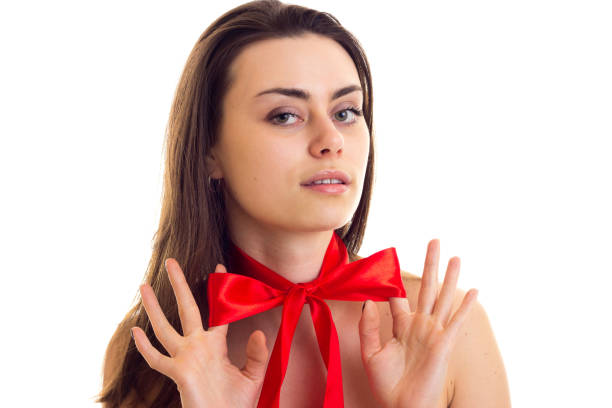 istock Young woman with red bowtie 689794536