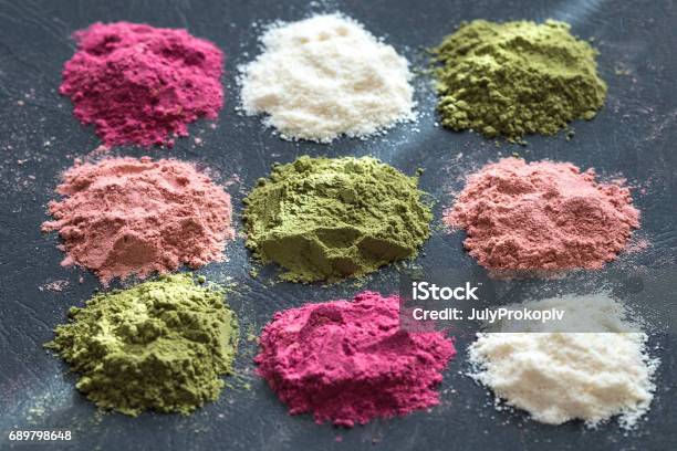 Various Colorful Superfood Powders On Dark Background Healthy Food Supplements Detox Concept Top View Stock Photo - Download Image Now