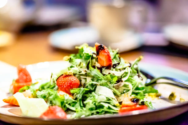 istock Salad of arugula and strawberries with balsamic vinegar 689802032