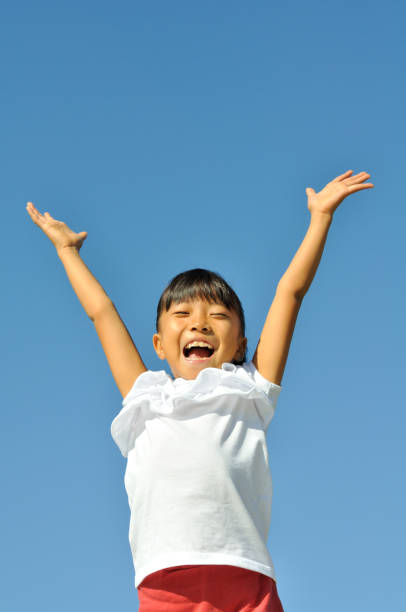 istock Girl bangzaiing in the blue sky 689815164