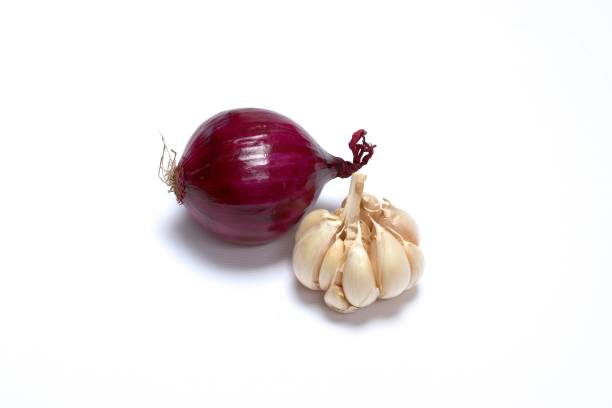 istock Garlic and red onion on white background. 689818528