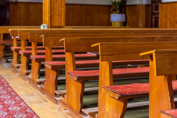 istock Church benches with little depth on field 689821850