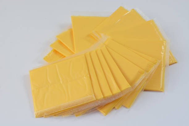 American cheese slices American cheese slices individually wrapped in plastic American Cheese stock pictures, royalty-free photos & images