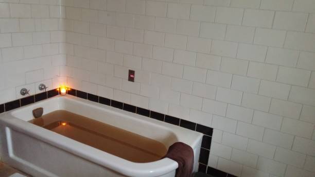 istock Relaxation Spa Iron Rich Natural Mineral Bath Tub Brown Water 689828726