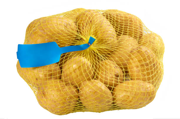 istock potato in yellow Plastic Mesh Sack on White Background 689838526