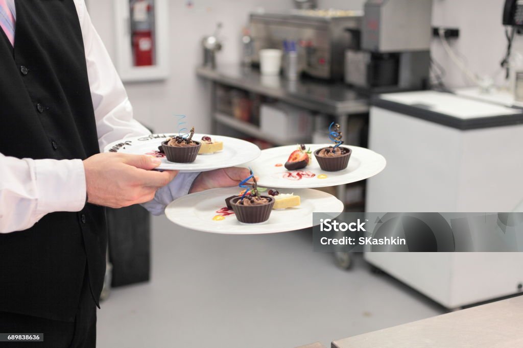 Kitchen action. Serving. Kitchen action. Serving. Horizontal. Appliance Stock Photo