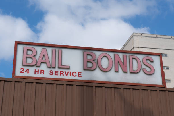 Bail Bonds Sign Bail Bonds sign on top of building bounty hunter stock pictures, royalty-free photos & images
