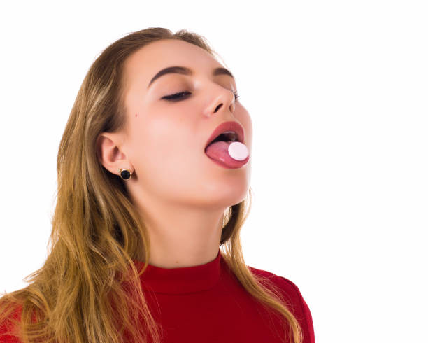 istock Young pretty woman, pill, white background 689867814