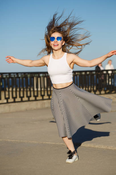 istock Girl on the city pier. 689879078