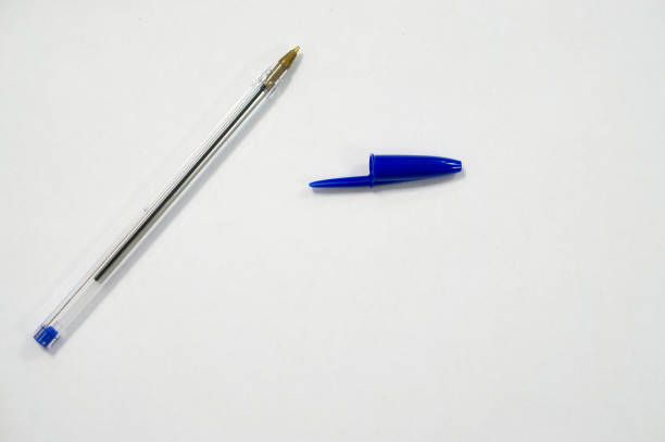 blue pen on white background - caneta esferográfica imagens e fotografias de stock