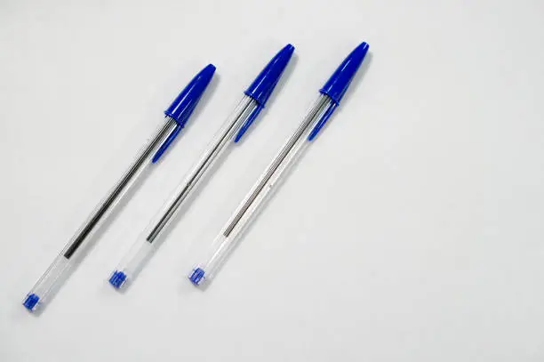 Photo of blue pen on white background