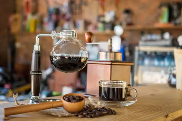 Photo of Siphon vacuum coffee maker on cafe bar