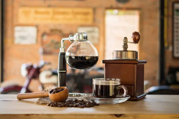 Photo of Siphon vacuum coffee maker on cafe bar