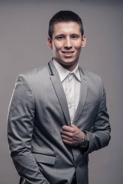 istock one young man, upper body, happy, smiling, formal clothes 689890368