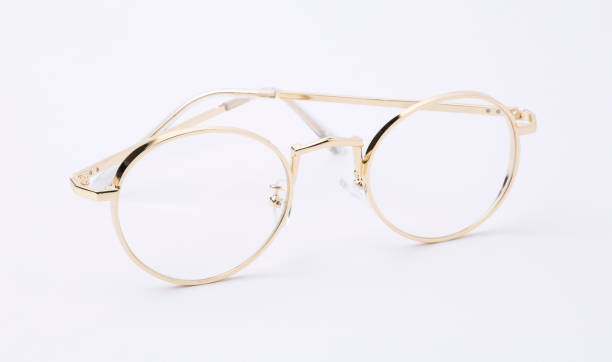 istock classic gold round glasses on white background 689893286