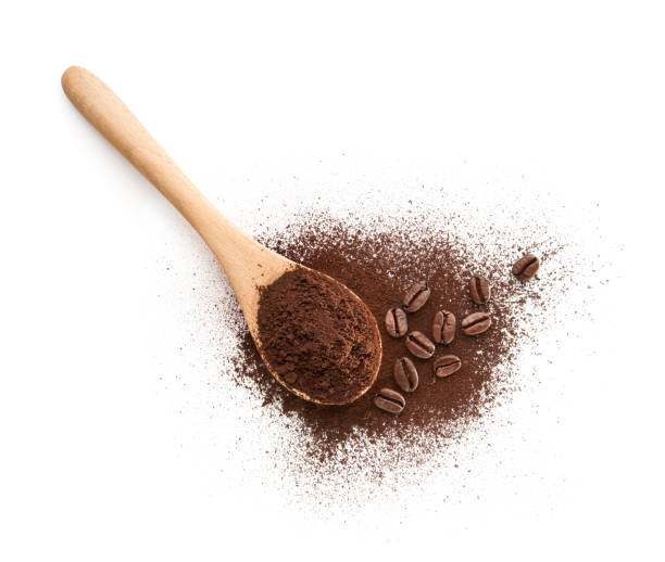 Wooden Spoon filled with coffee powder Wooden Spoon filled with coffee powder isolated on white background instant coffee stock pictures, royalty-free photos & images