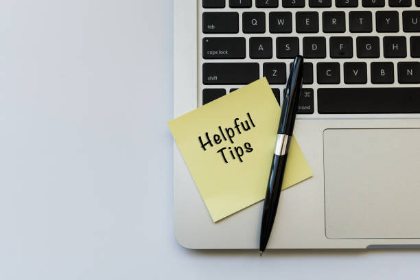 istock HELPFUL TIPS word concept on sticky note and a pen over top view flat lay isolated on white background. 689900450