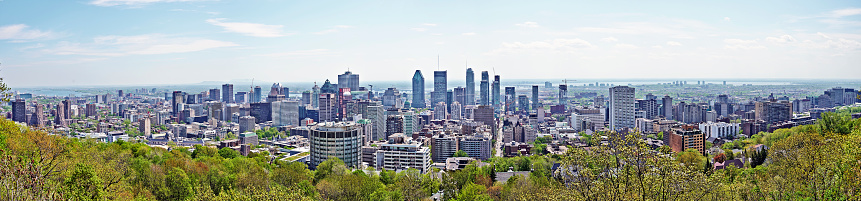 MONTREAL, QUEBEC, CANADA - 18 MAY 2017: Skyline Panorama of the city of Montreal, Quebec, Canada. Shot from the Mount Royal above the city.