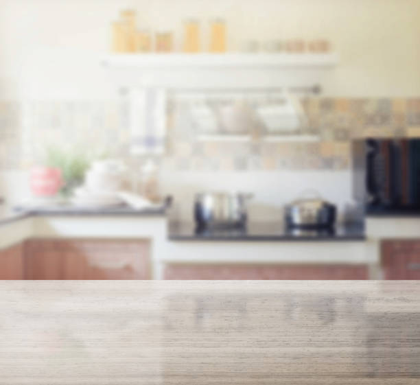 istock granite table top and blur of modern kitchen interior as background 689911208
