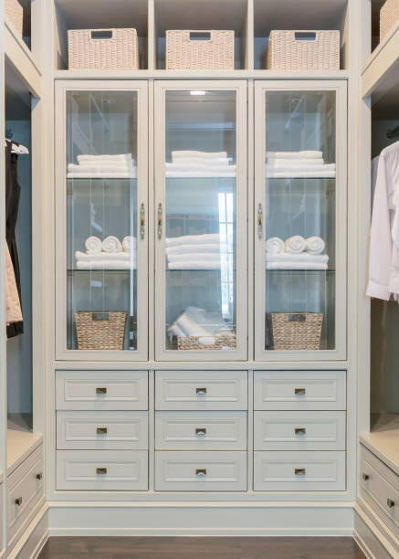 istock large white walk-in closet with shelves at home 689912600