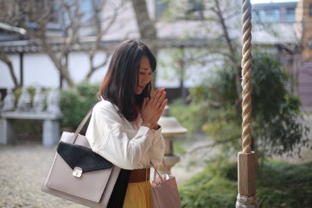 istock Women praying at shrine in Kyoto 689919914