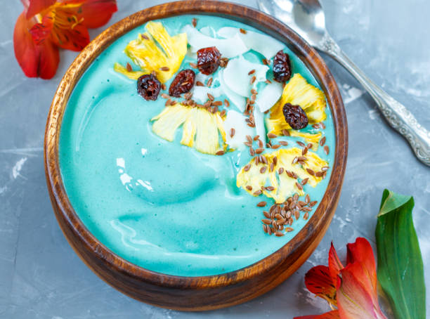 istock Blue spirulina smoothie bowl with pineapple and coconut. 689920488
