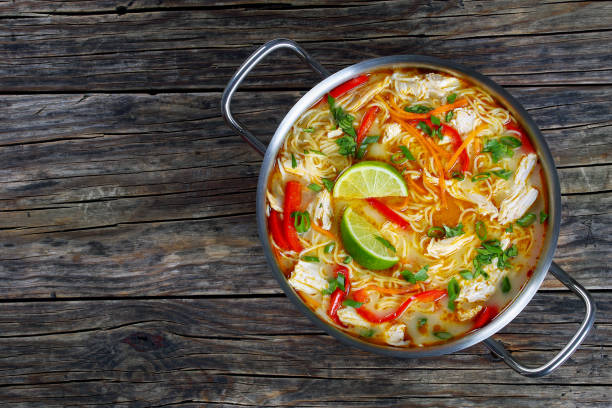 istock Delicious and spicy thai chicken noodle soup 689935912