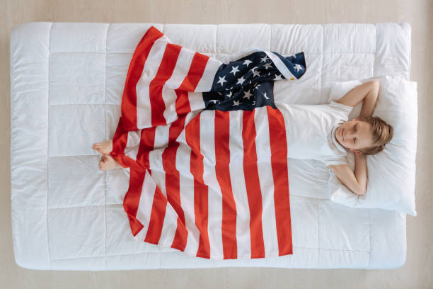 istock Joyful cute boy enjoying his dreams 689944044