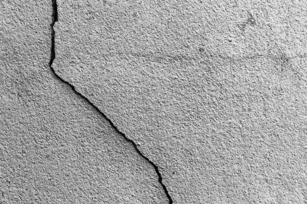 istock Grunge concrete cement wall with crack in industrial building 689945048