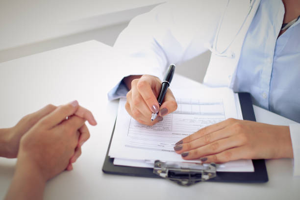 istock Doctor and patient are discussing something, just hands at the table 689945710