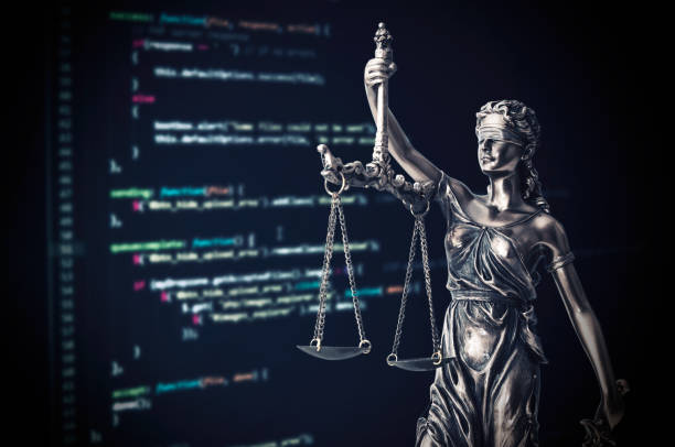 Justice statue with code on monitor device in background Justice statue with code on monitor device in background. programming code law crime justice internet statue themis concept computer hacker security computer stealing stock pictures, royalty-free photos & images