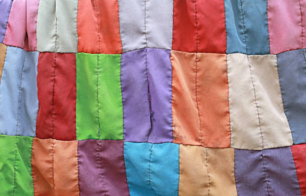 istock Abstract Background of colorful fabric scraps left over from sewing. 689952354