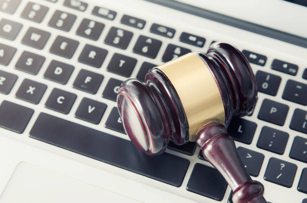 istock Wooden gavel on laptop keyboard 689952398