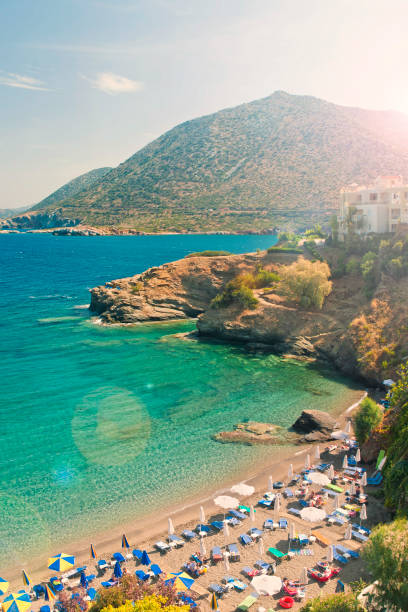 istock beautiful small beach, sea and mountains at sunset 689952446