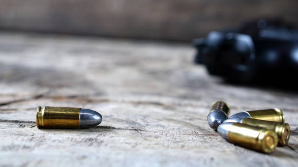 istock Bullets and a firearm on the wood 689966828