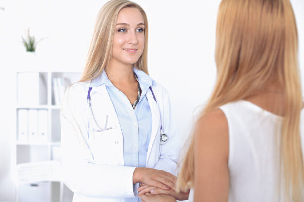 istock Doctor and  patient handshake in hospital 689967952