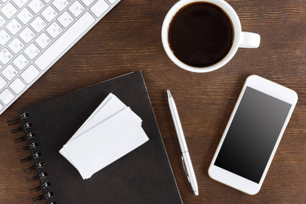 istock flat lay with coffee cup, blank cards and wireless devices on workplace 689968100